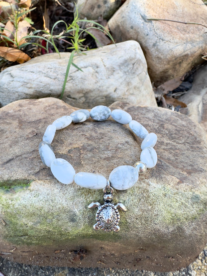 Oval-Shaped Howlite Bracelet With Silver Plated Turtle Charm